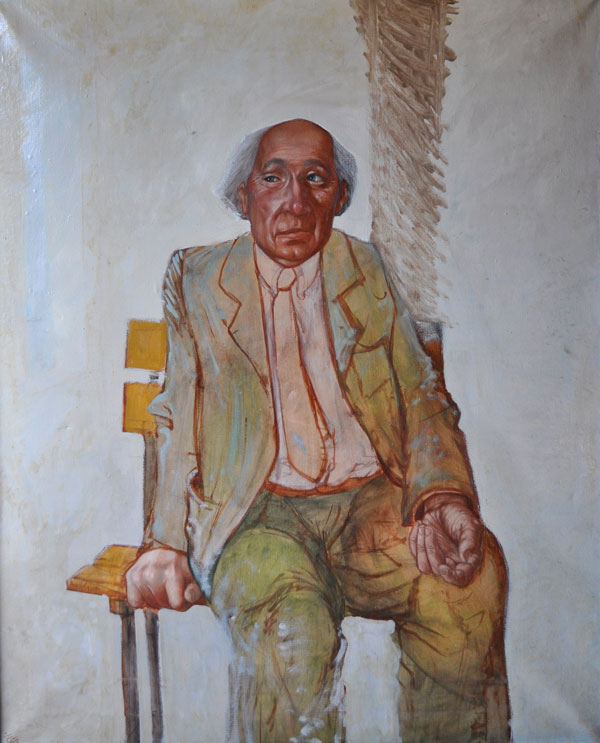Un homme âgé en costume et cravate.