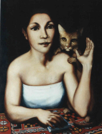 Une femme  à une table avec un chat à son côté.